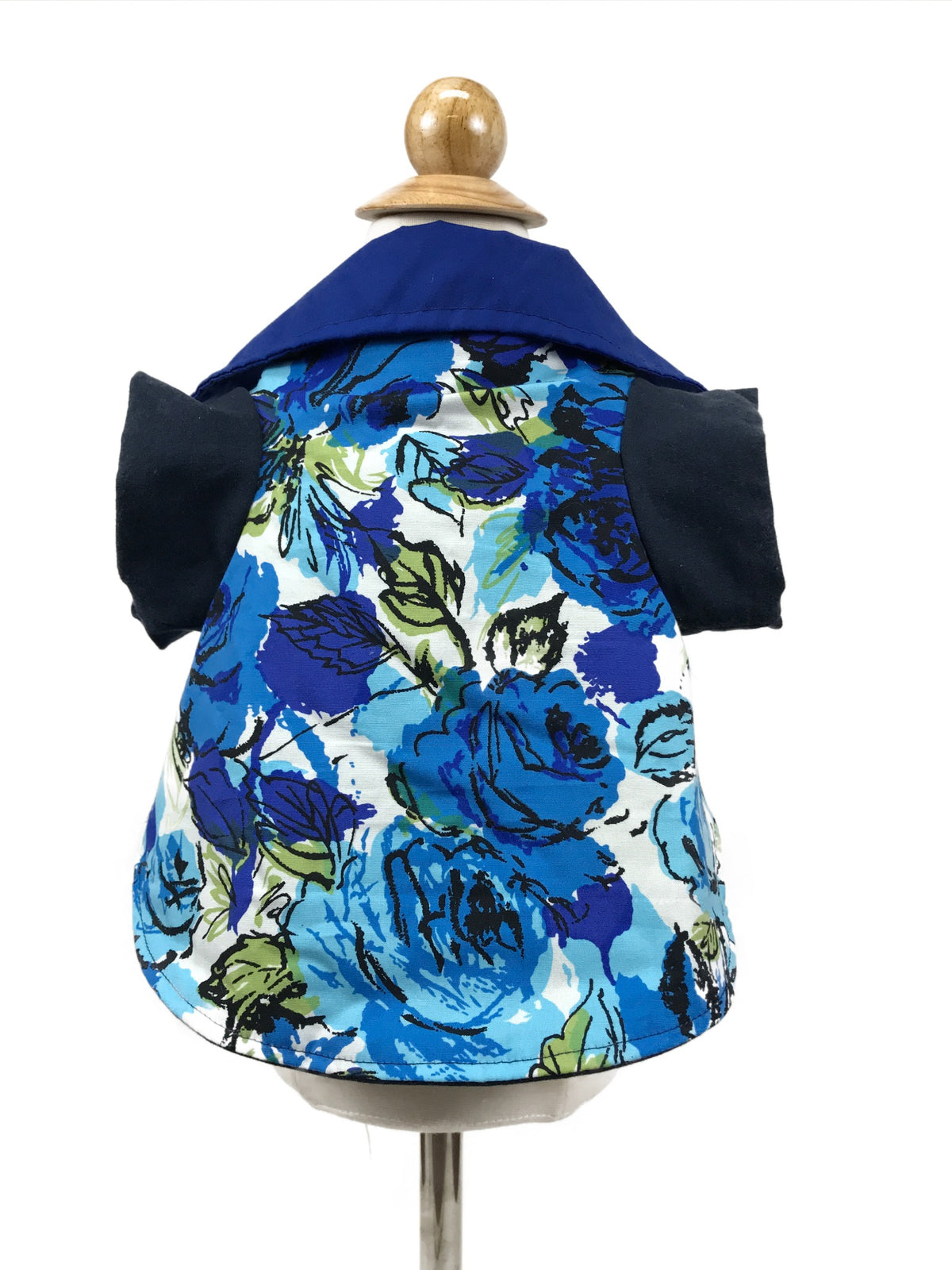 Blue rose floral collared dog shirt displayed on mannequin, showing the print, royal blue collar and navy sleeves
