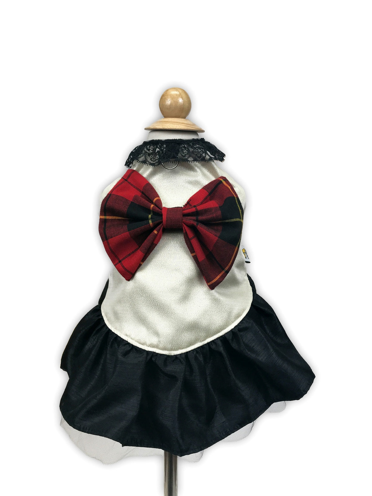 Back mannequin view of Tartan Couture dog dress with oversized red and black plaid bow, black lace neckline, ivory bodice and full black skirt