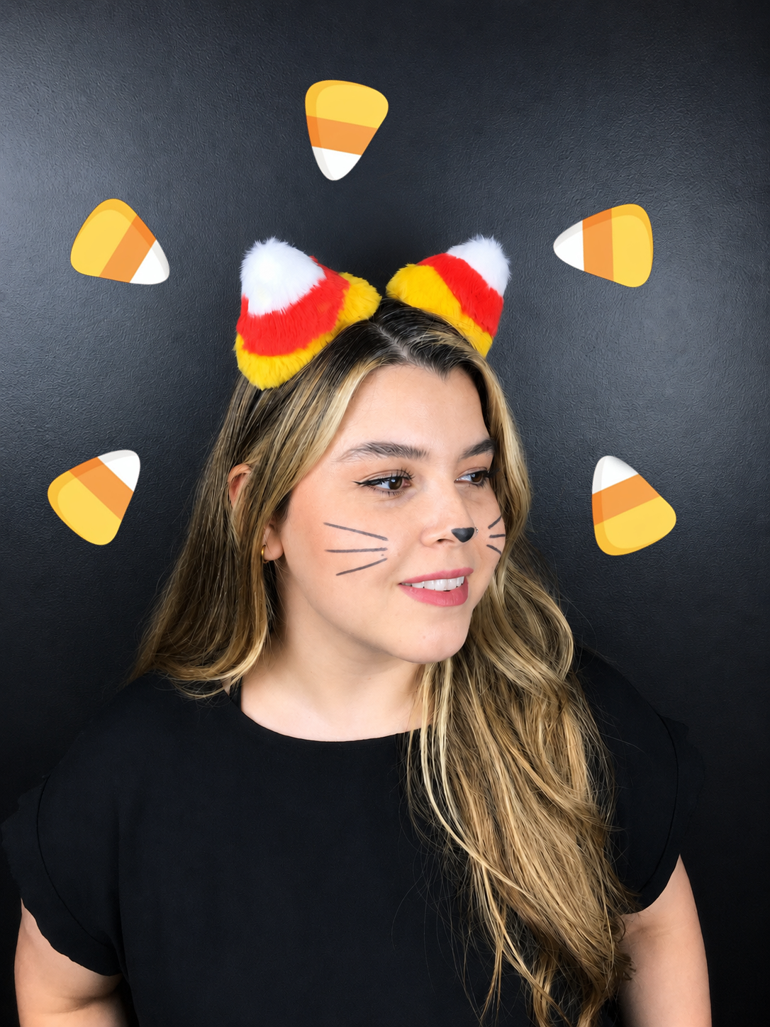Handmade candy corn cat ears headband in fluffy yellow red and white worn by model with cat makeup