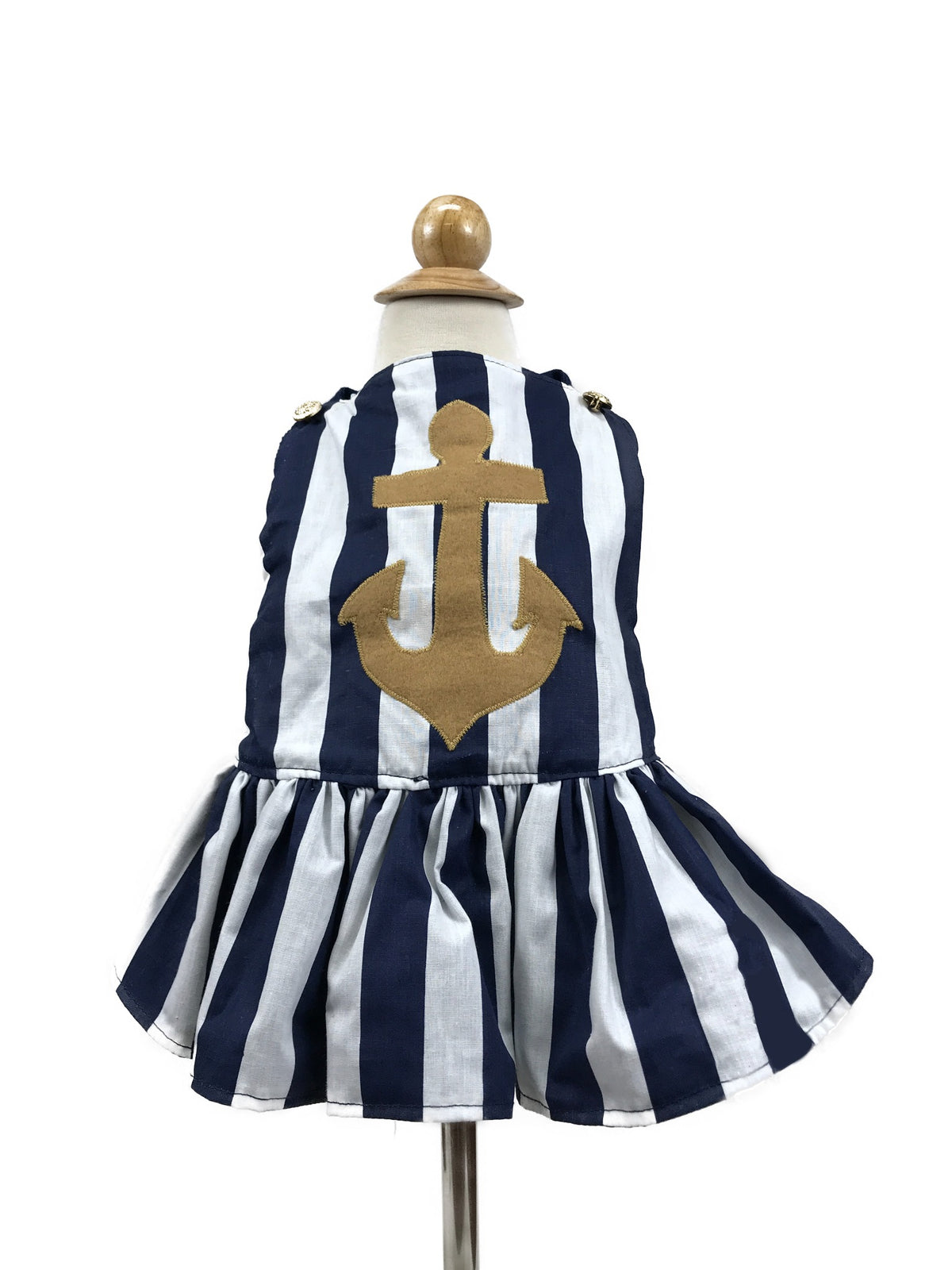 Back of Sail Away navy and white striped dog dress with gold anchor applique, gold-tone shoulder buttons and gathered skirt